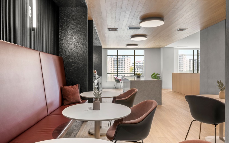 a large coworking space with tables and seating