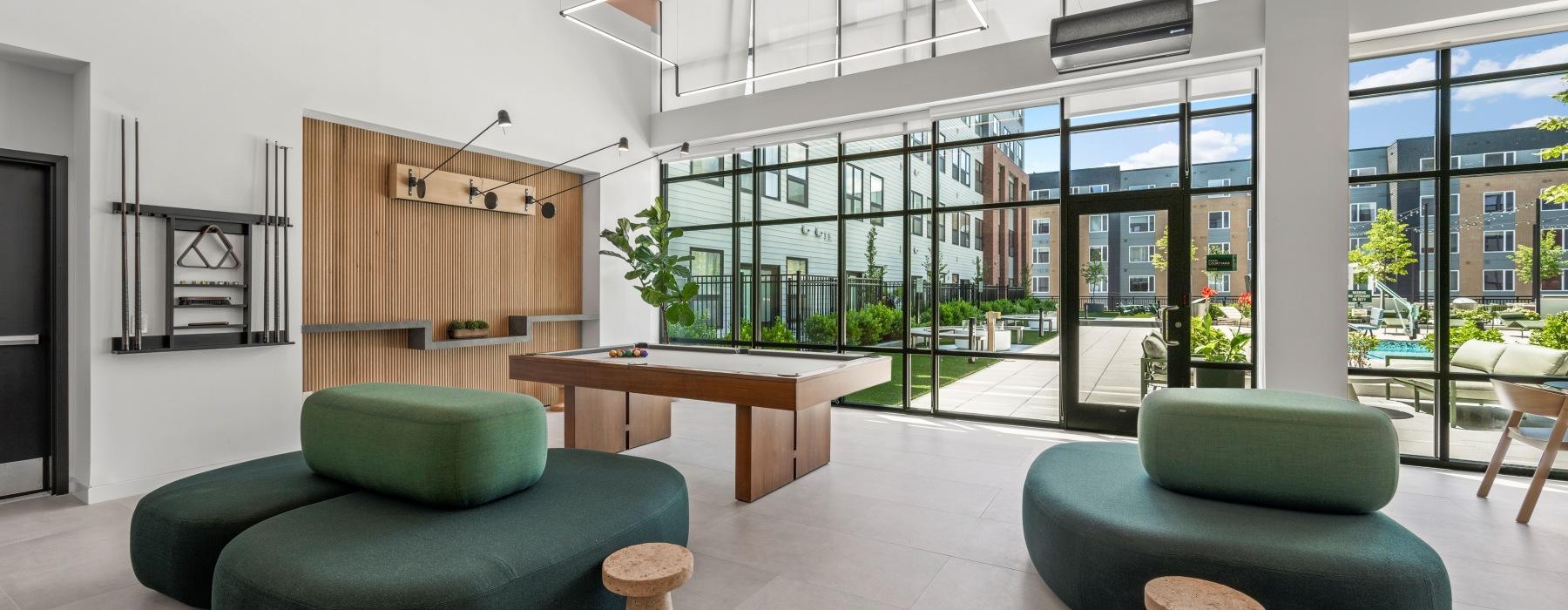 Resident lounge with pool table and seating area