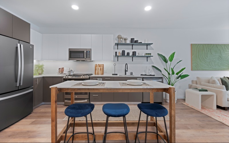 Kitchen with island seating and custom shelving