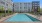 A pool in front of a building